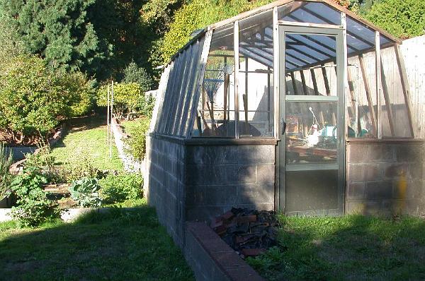 DSCN1118.JPG - Greenhouse along north property line.  To be rehabilitated.  The area to left is now raised bed vegetable garden.