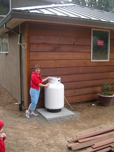 IMGP1702.JPG - Propane for cooktop, BBQ, and fireplace, plus a good look at the "flipped" siding.