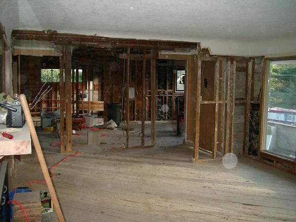 IMGP0984.JPG - Hallway, wing walls, and dining room walls being removed.  The window wall on the right will be pushed out and become the interior wall of the new sunspace.