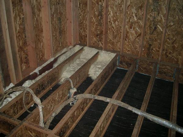 IMGP1096.JPG - Soy based polyurethane foam being spayed in between floor joists in bedroom wing.