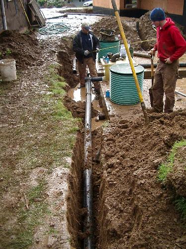 IMGP0976.JPG - Hooking up the raindrain lines from the back of the house.