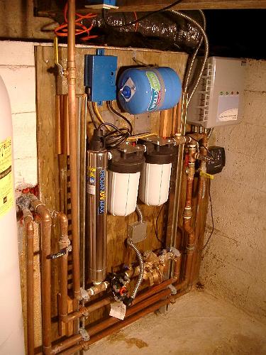 IMGP1733.JPG - The filtration system.  10 and 20 micron filters plus UV disinfecting.  City water is the backup in case the tanks are empty or there is a power failure (pump doesn't run).